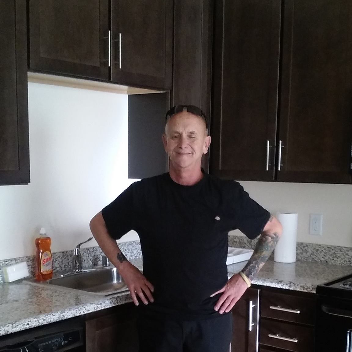 Richard in his new apartment